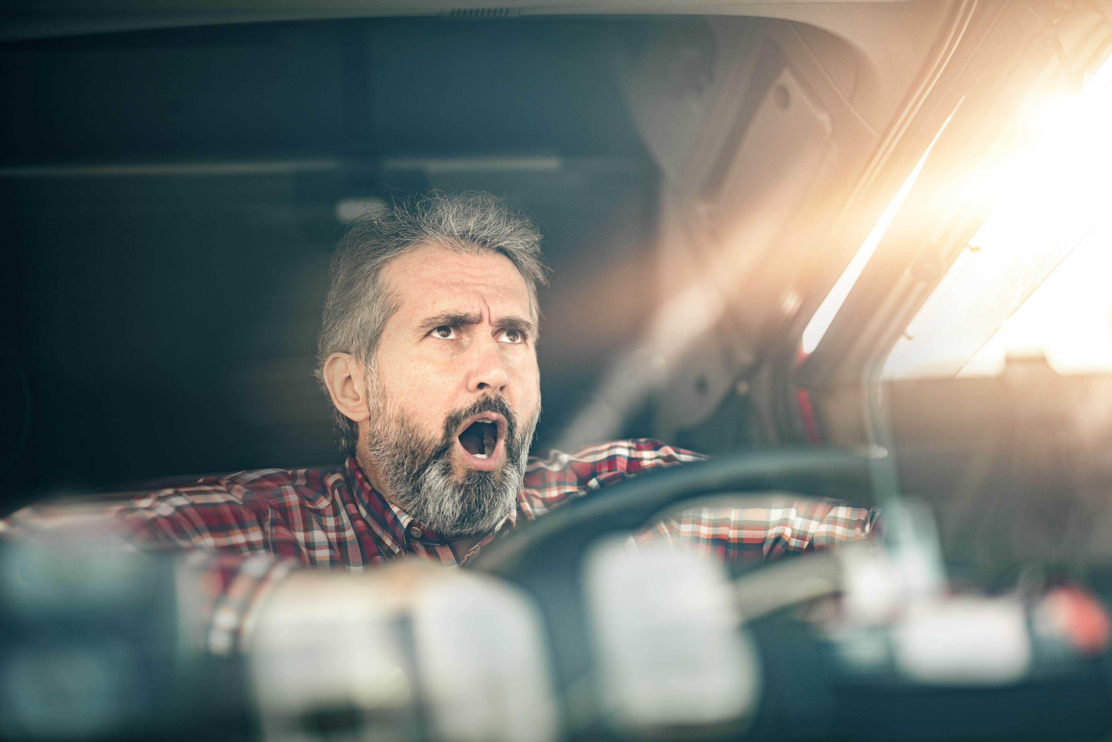 Truck driver yawning